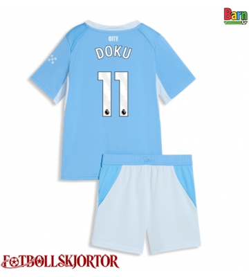 Manchester City Jeremy Doku #11 Hemmakläder Barn 2026-27 Kortärmad (+ Korta byxor)